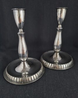 A pair of candlesticks of nickel silver